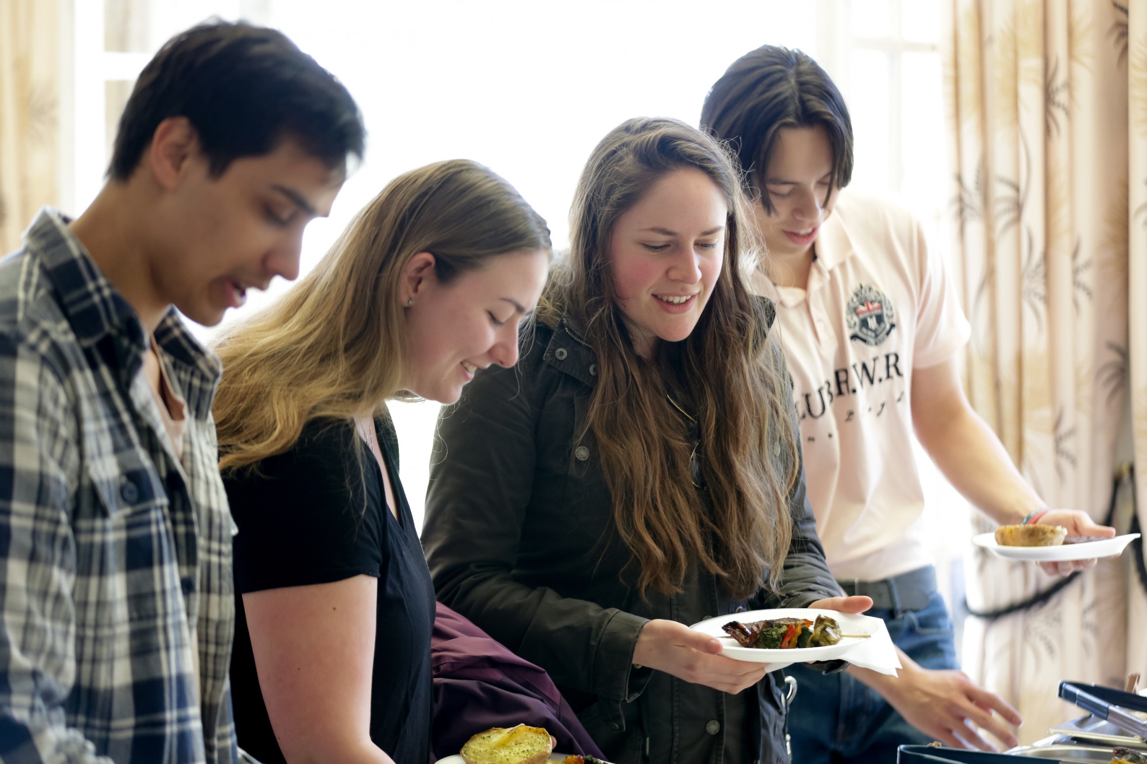 young people being served food