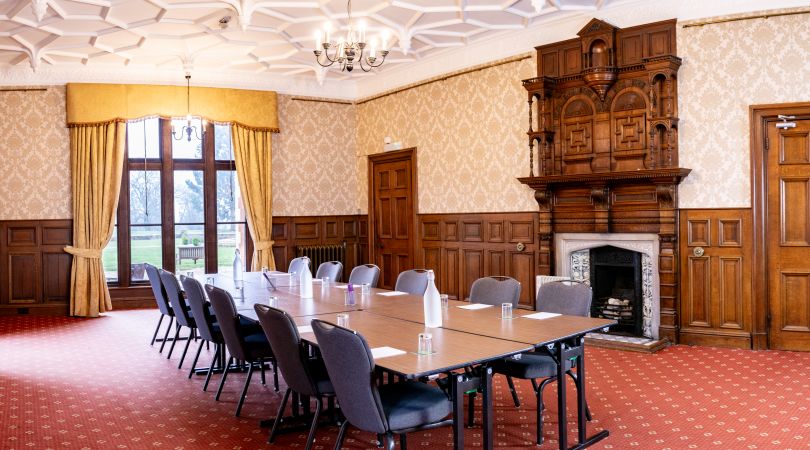 Small meeting room with table and chairs