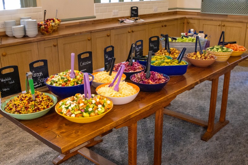 An image of the salad table at High Leigh with a variety of Nadia's Moroccan salads