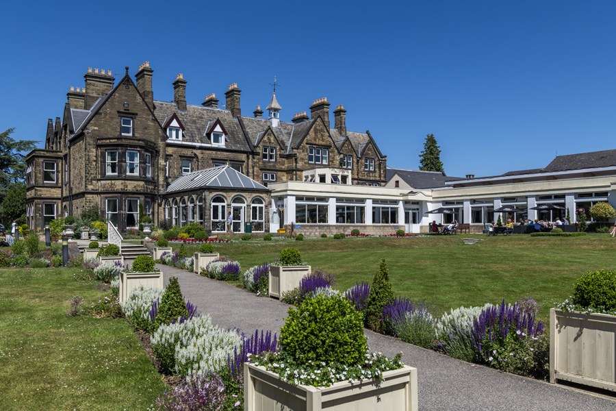 A beautiful image of The Hayes with its gardens on a sunny summers day