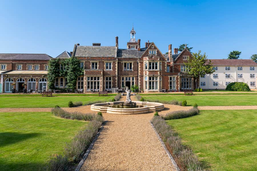 High Leigh during the summer with piercing blue sky and bright green grass.