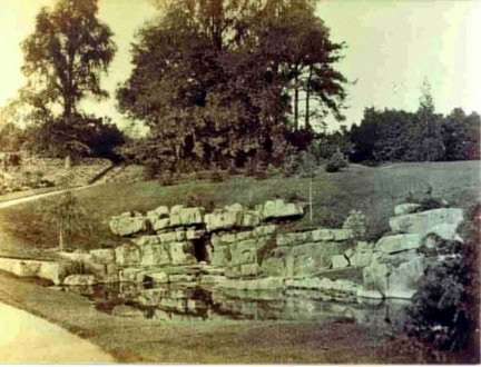 The Pulhamite rockery and cave in 1900 with a lot less trees and foliage.