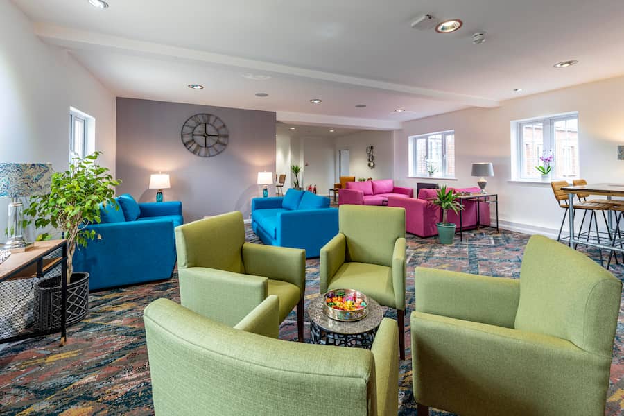 A bright image of the Ellen Lounge at High Leigh with its colourful furniture.