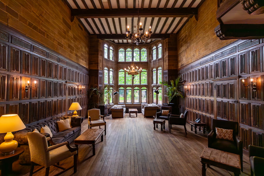 Baronial Hall at Highgate House conference centre showing the wooden panelling and the tasteful furniture we have added. 