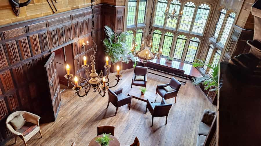 A photo of the Baronial Hall taken from above showing the oak panelling obtained from an Elizabethan Hall.