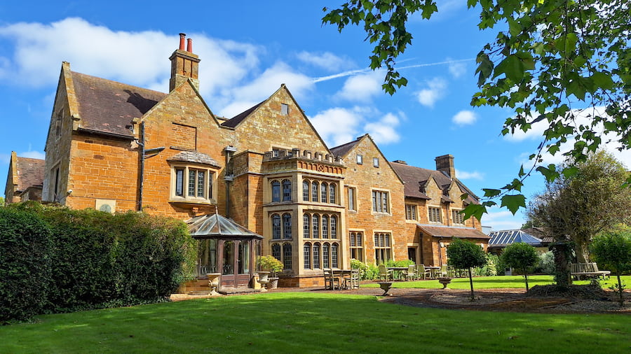 The back of Highgate House with the sun shining down.