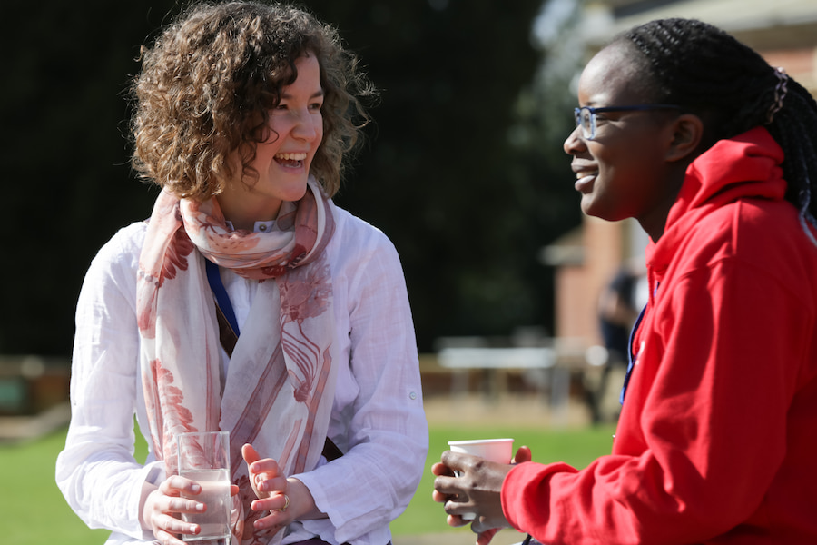 Two women talking to each other outside High Leigh conference centre on a women's retreat.