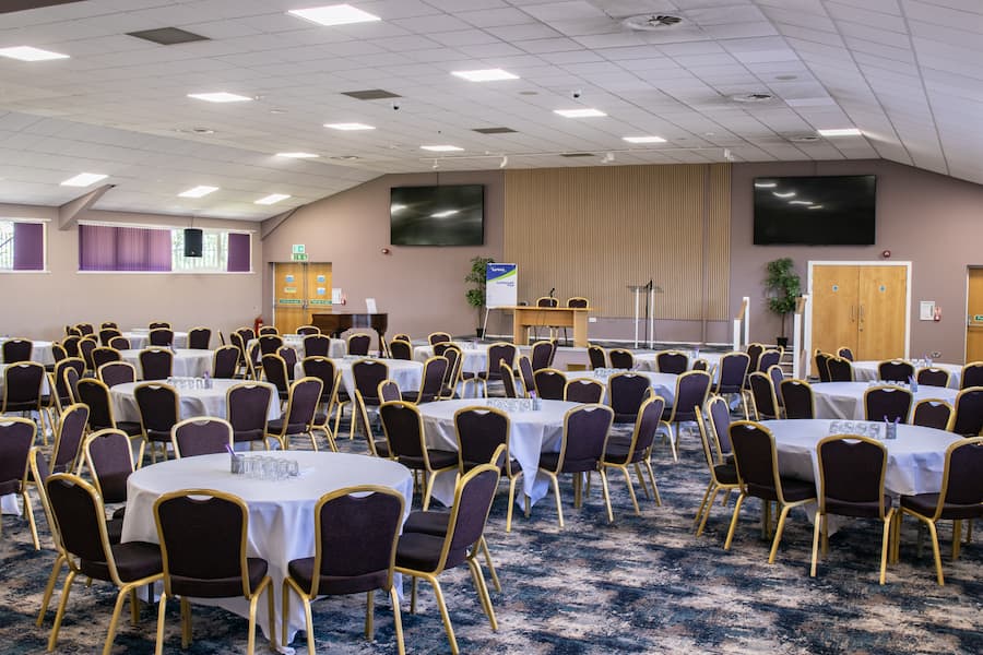An additional angle of the Derbyshire Hall showing a banquet set up and the new refurbishments.