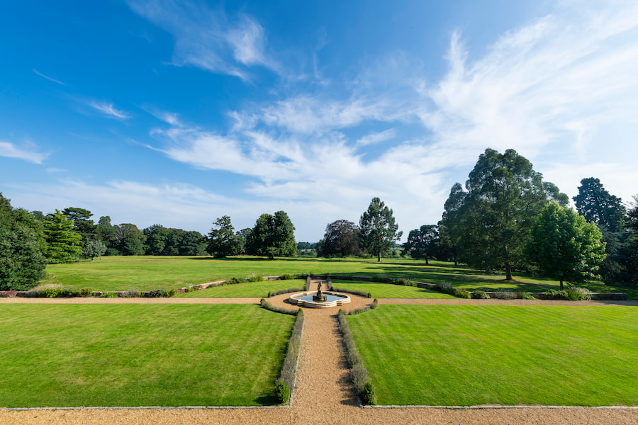 Overlooking the grounds at High Leigh showing the large garden and rural surroundings.