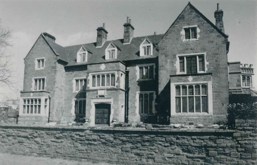 A black and white photo of the front of Highgate House after the renovations in the early 1900s.