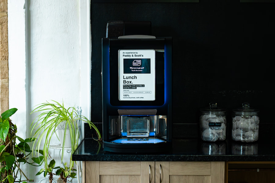 A coffee machine at one of our conference centres with Paddy & Scott's branding.