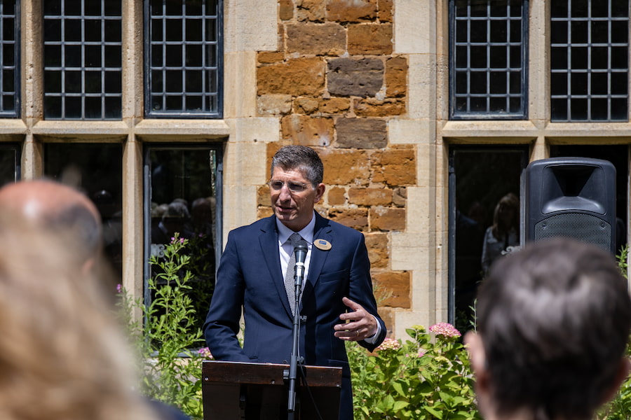 John Heasman, Chief Executive of Christian Conference Trust, speaking to a crowd of people at the Highgate House Dedication Ceremony.