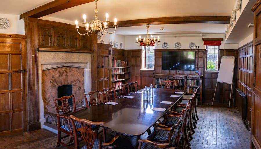 The Library room showing the TV, book shelves and windows.