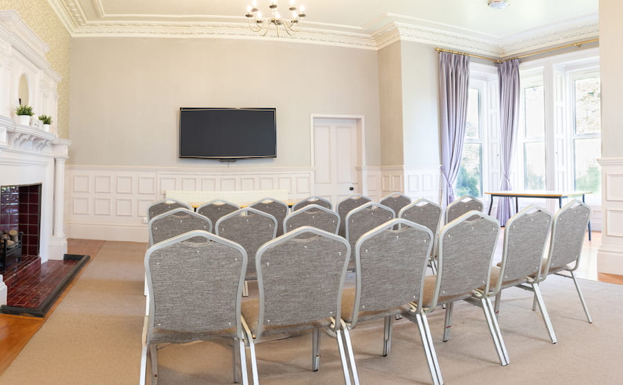 Reading Room set in Theatre style showing the windows and a flat screen TV 