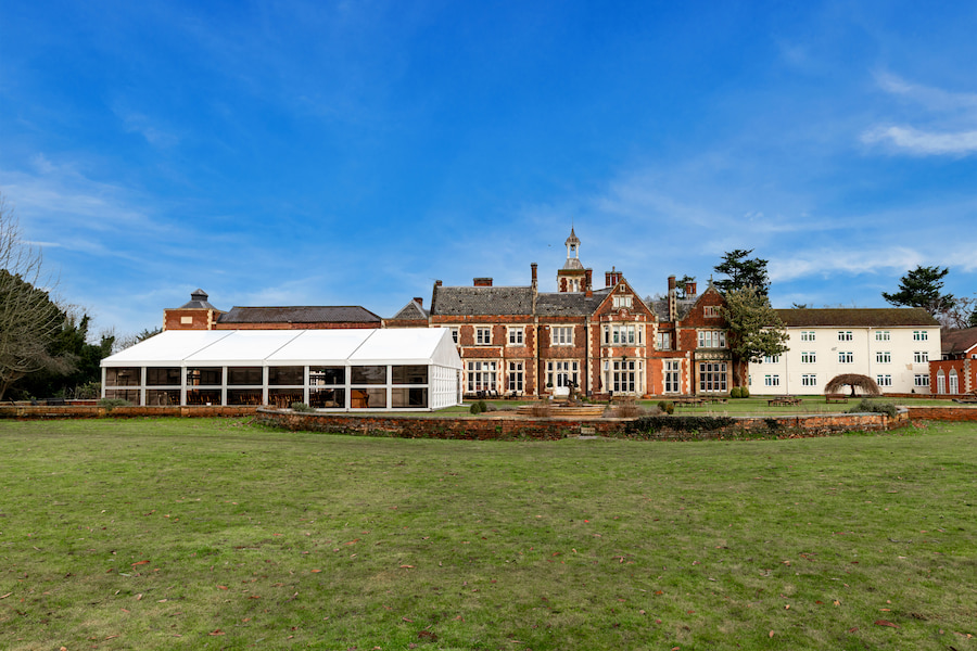 An exterior photo of High Leigh showing the Garden Suite building with large windows.